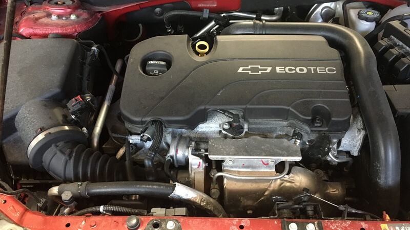 GM small turbo Ecotec engine under the hood of a similar Chevrolet sedan