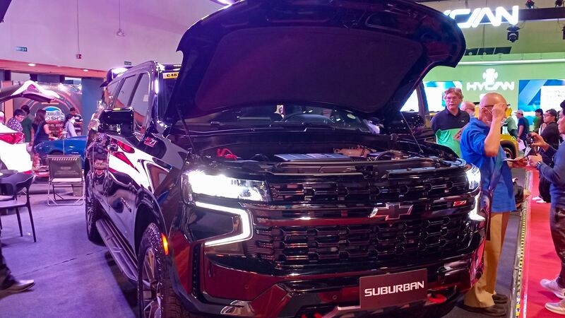 Black 2024 Chevrolet Suburban Z71 with the hood open
