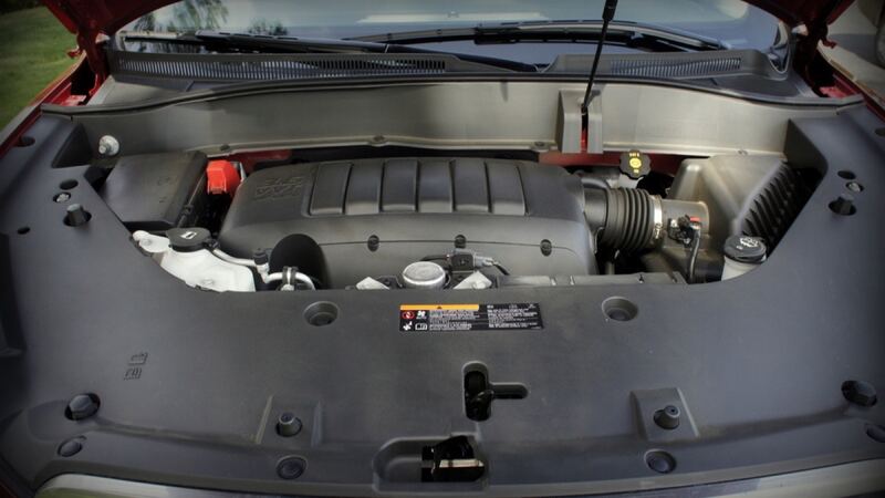 Engine bay of a 2013 GMC Acadia, the Traverse's sibling, with the hood open