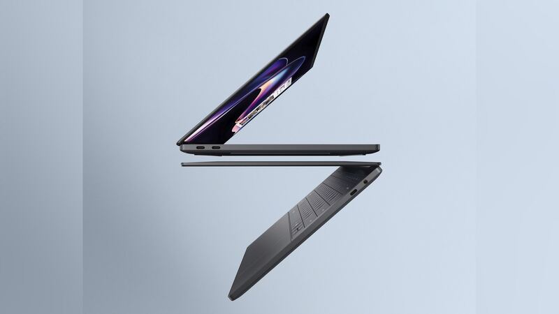 Dell XPS 14 (2026) in Graphite shown from the side, one open and one upside down, official Dell image