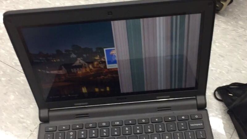 A Dell laptop with vertical lines across half the screen from a damaged display connection (similar laptop, not an XPS 14)