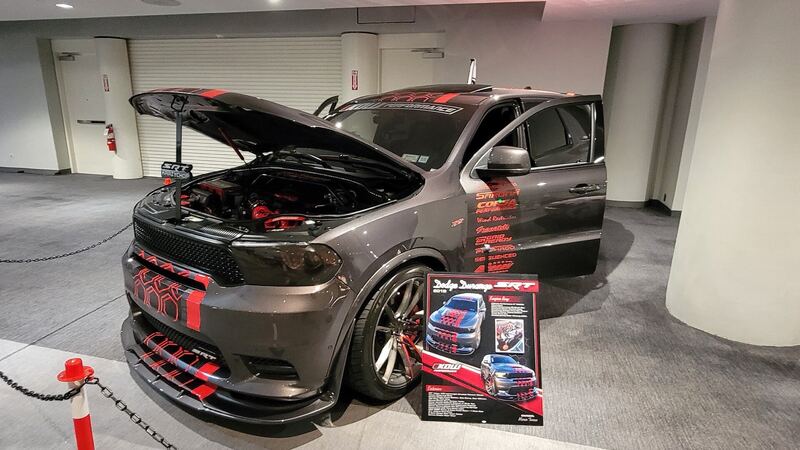Gray 2018 Dodge Durango SRT with the hood open at a car show