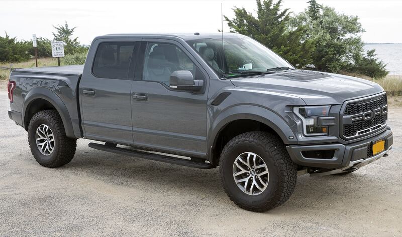 2018 Ford F-150 Raptor in Lead Foot gray, front right view