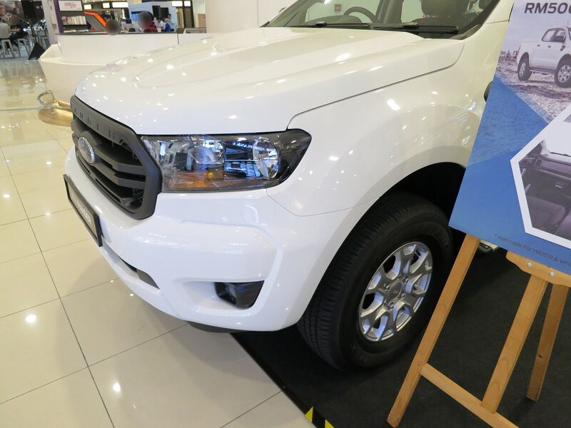 White Ford Ranger pickup, front three-quarter view