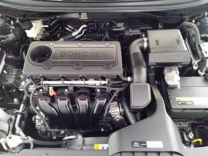 Engine bay of a black 2020 Hyundai Sonata 2.4 with the hood open