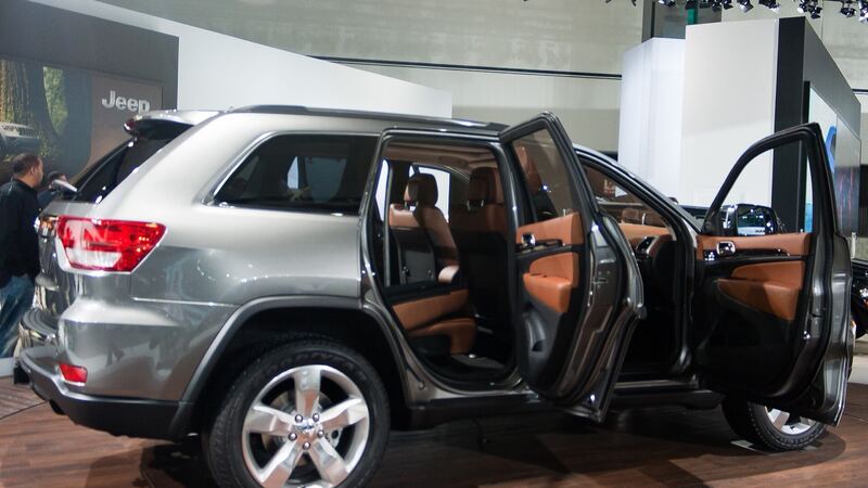 Silver Jeep Grand Cherokee WK2 parked with its doors open