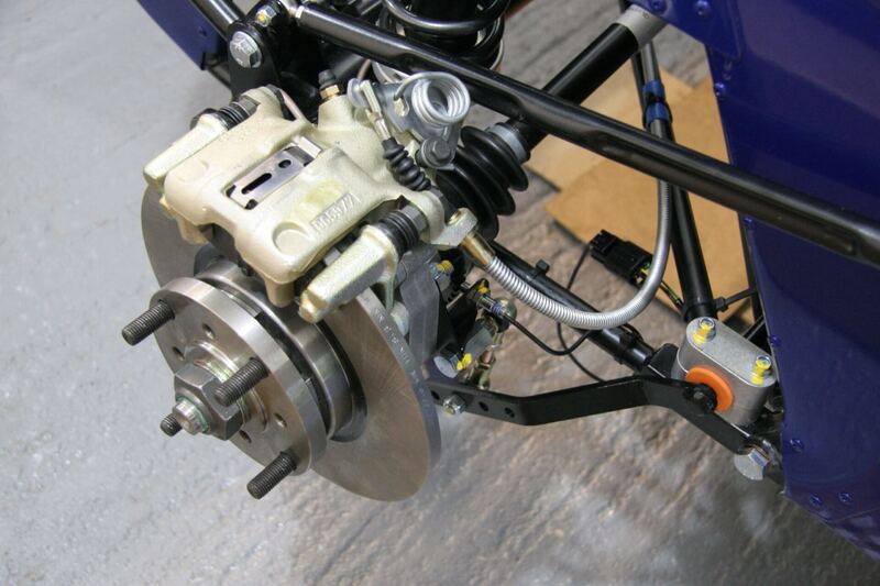 Disc brake rotor and caliper on a wheel hub with the wheel off (similar vehicle)