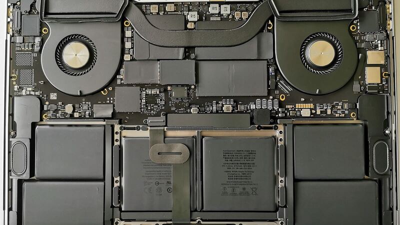 Inside a 16-inch MacBook Pro with the bottom case off, showing the battery cells (earlier 16-inch model)
