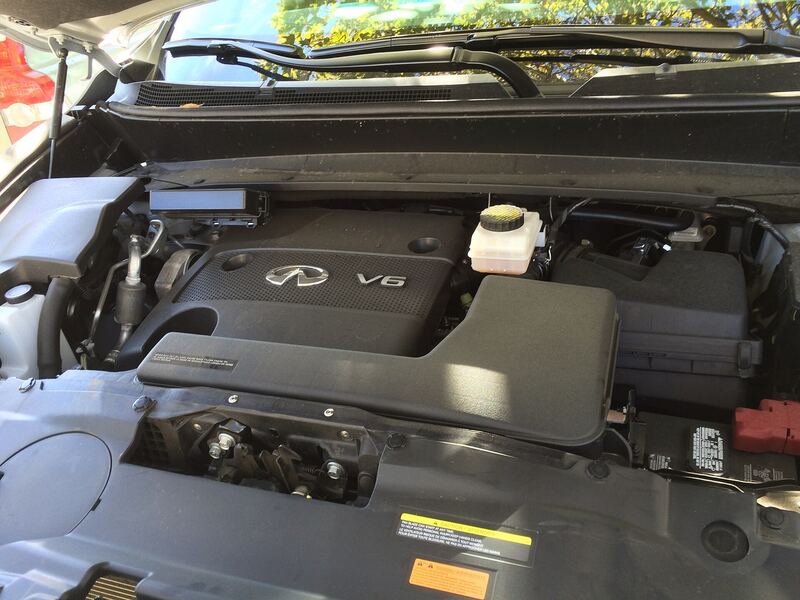 Open hood of an Infiniti QX60, the Pathfinder's V6 sibling, showing the 3.5-liter engine bay (similar vehicle)