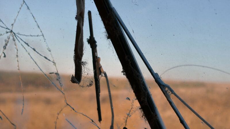 View through a cracked windshield with old wiper blades (similar vehicle)