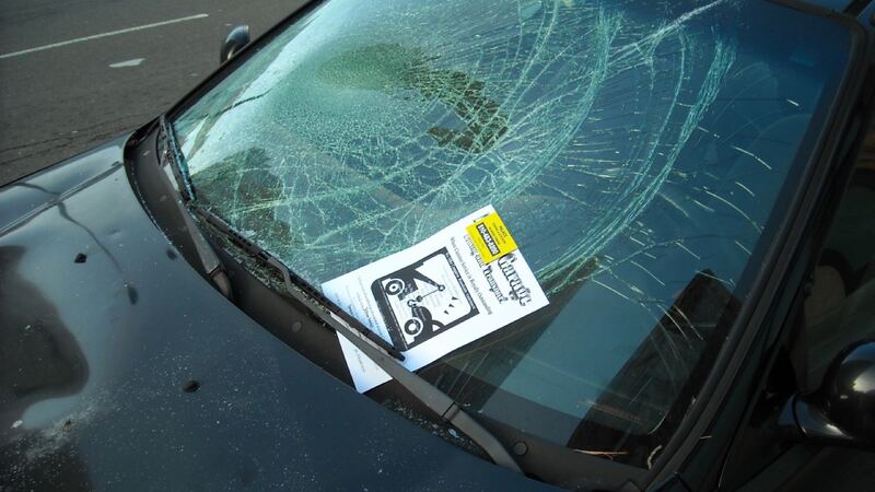 Car windshield shattered after an impact