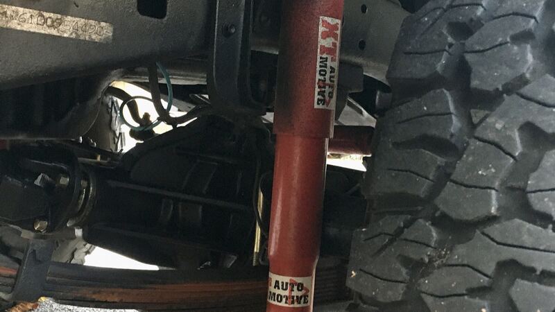 Front shock absorber and suspension under an older Toyota Land Cruiser 4x4