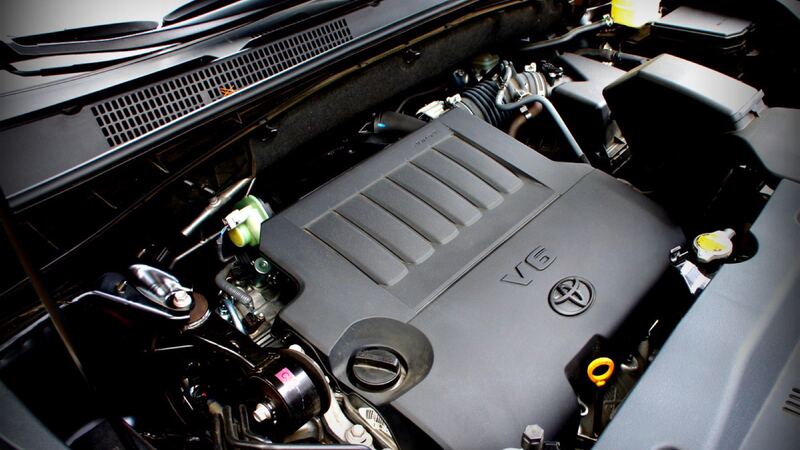 Side view of a 2014 Toyota Highlander engine with the hood open
