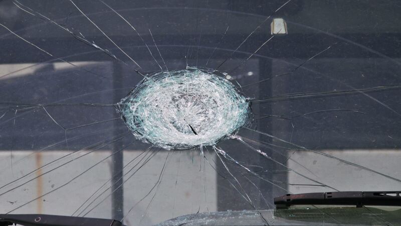 Truck windshield cracked by a hail stone impact (similar vehicle)